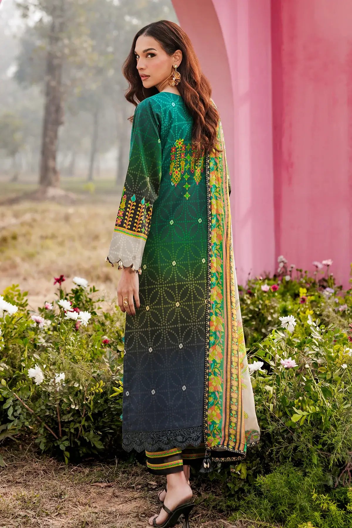 Beautiful Gulfraz embroidered lawn fabric with intricate embroidery design, showcasing vibrant colors and fine craftsmanship.