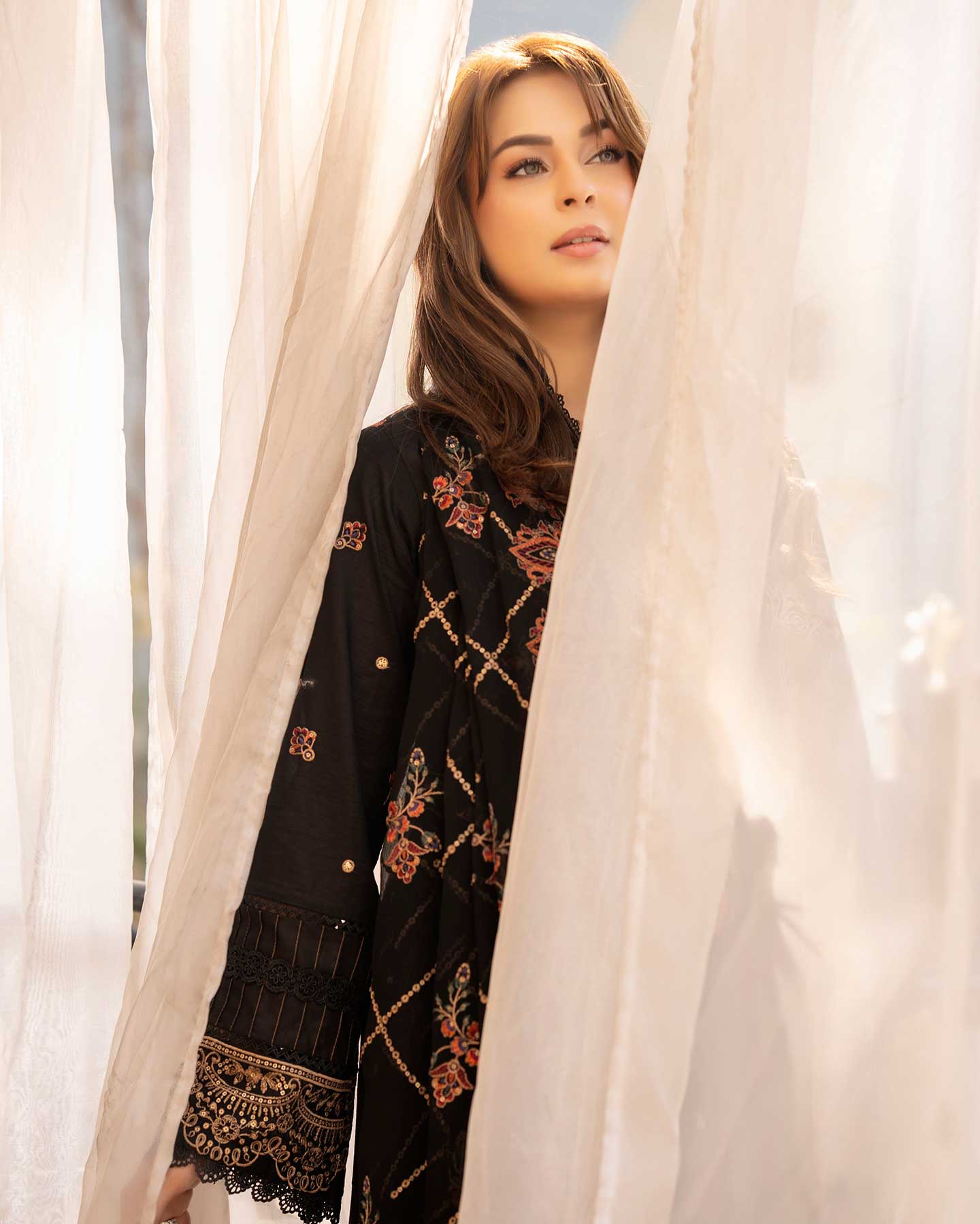 Embroidered Gulfraz lawn fabric D 05 with intricate floral embroidery, showcasing vibrant colors and detailed craftsmanship.