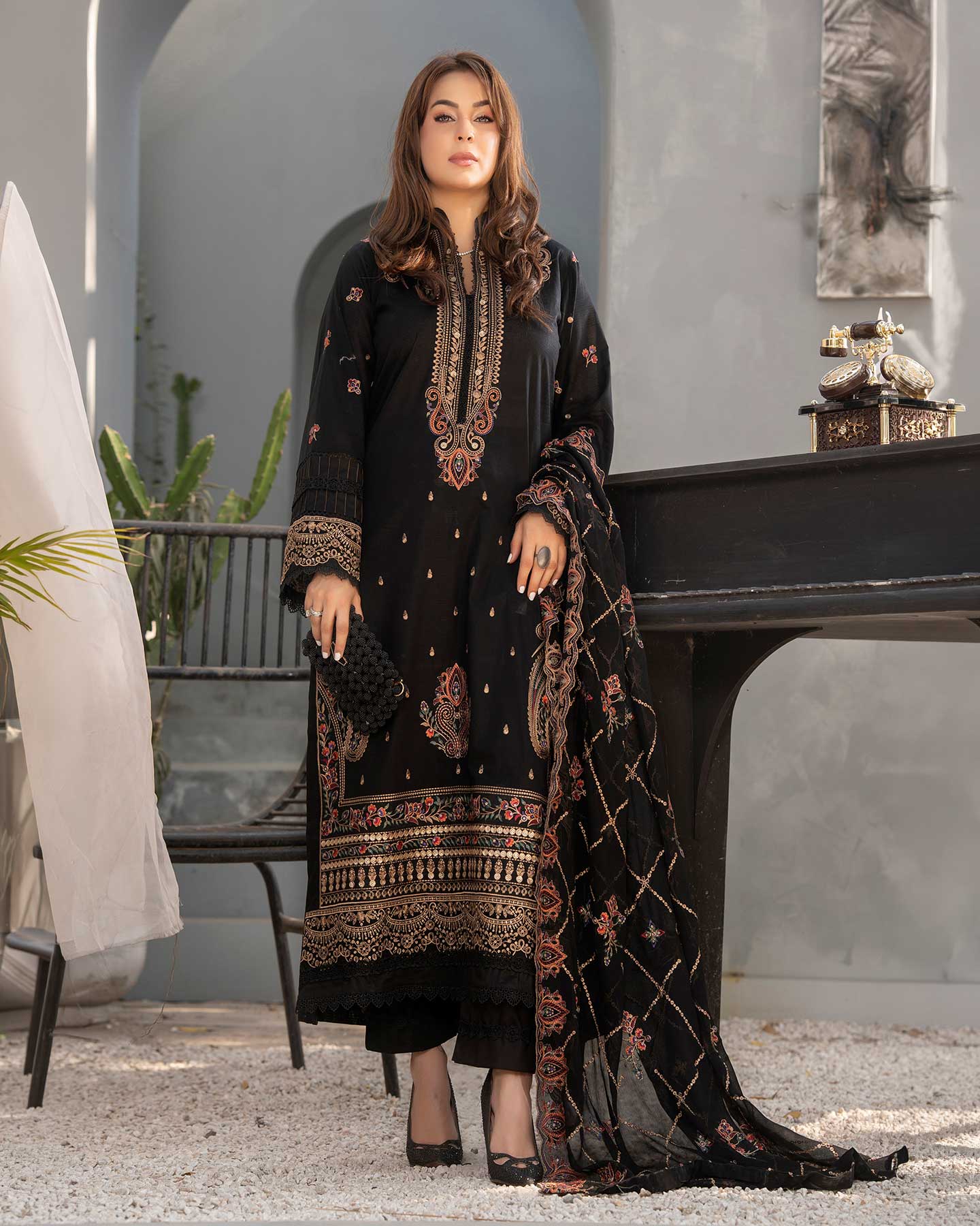 Gulfraz embroidered lawn fabric with intricate threadwork in vibrant colors, showcasing detailed embroidery on lightweight material.