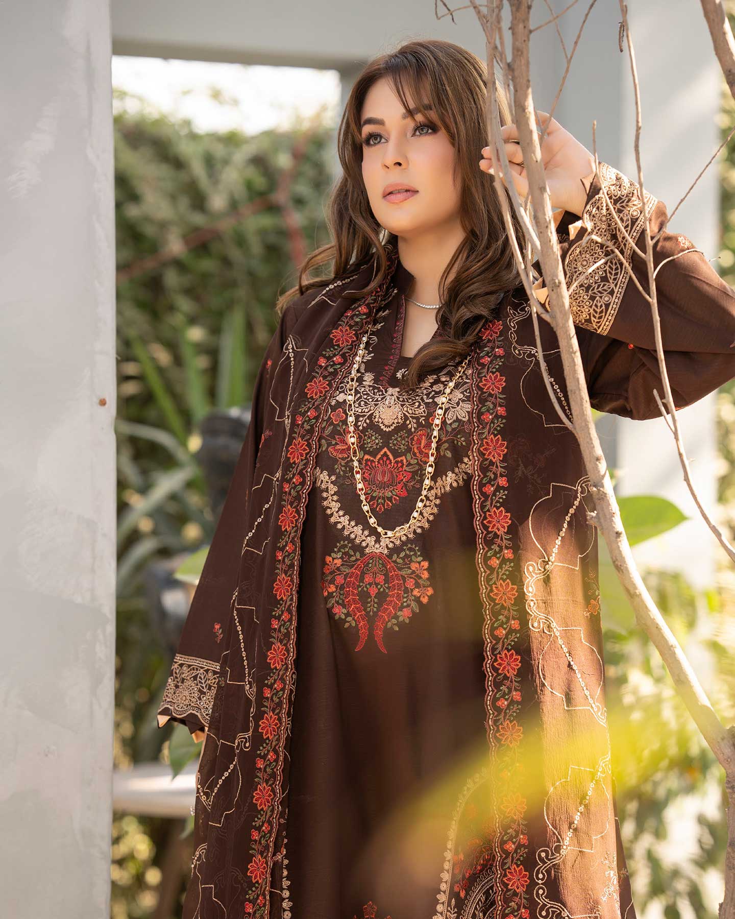 Embroidered Gulfraz lawn fabric D 04 with intricate floral embroidery, showcasing vibrant colors and detailed stitching.