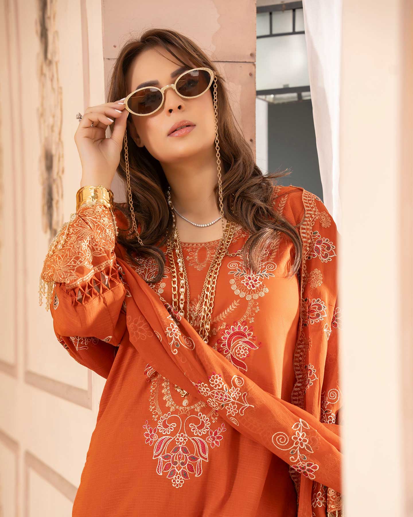 Elegant embroidered Gulfraz lawn D 06 fabric with detailed floral embroidery on soft, high-quality fabric for stylish summer wear.