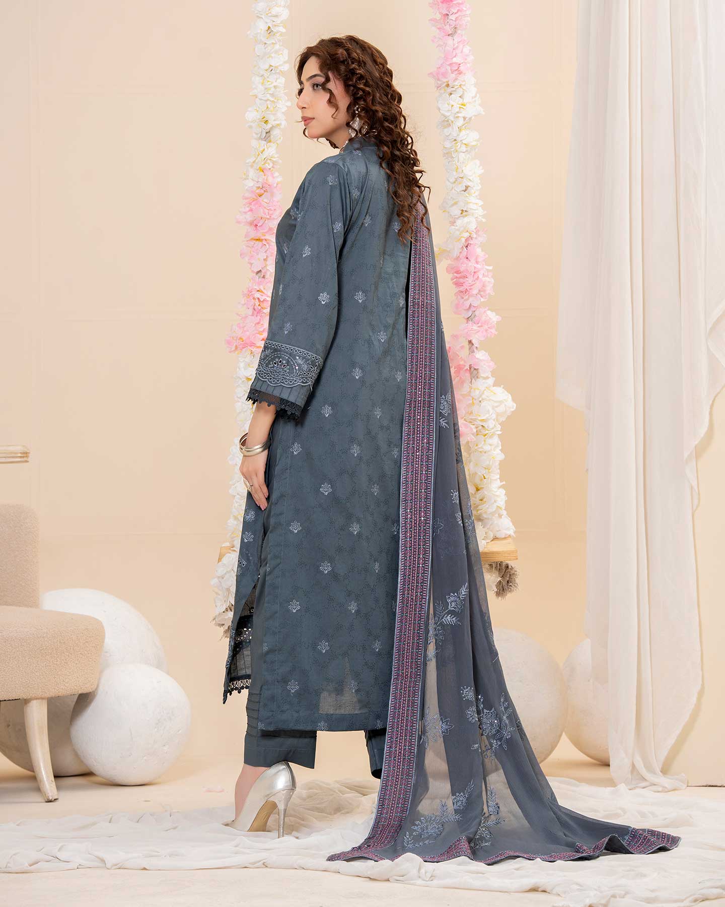 Embroidered Gulfraz lawn fabric D 02 with intricate floral embroidery on soft, lightweight material for elegant summer wear.