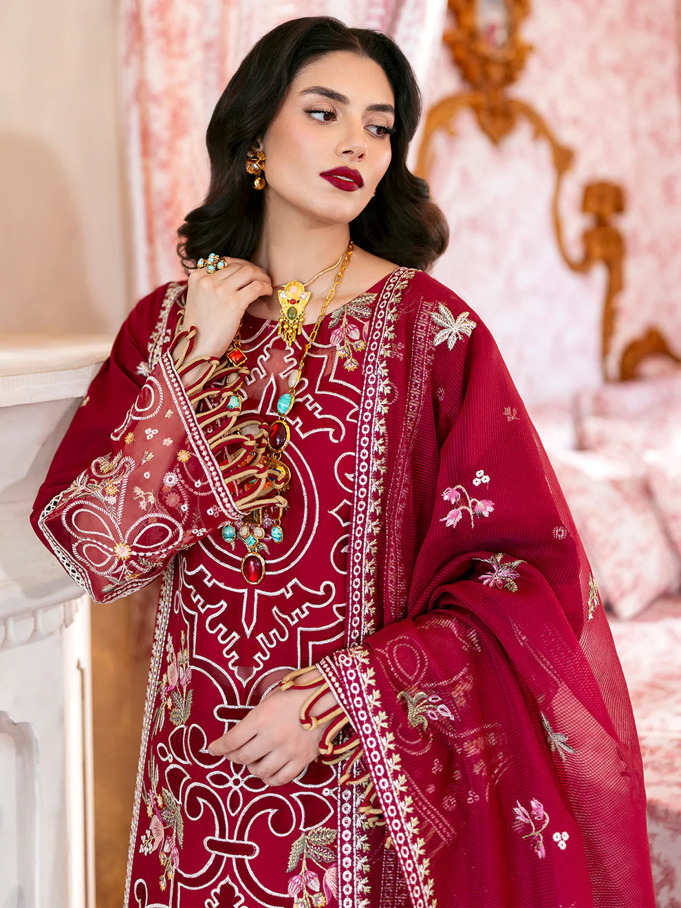 Luxury Gulfraz Ginny lawn fabric in vibrant floral pattern, showcasing colorful textile design on a fabric roll.