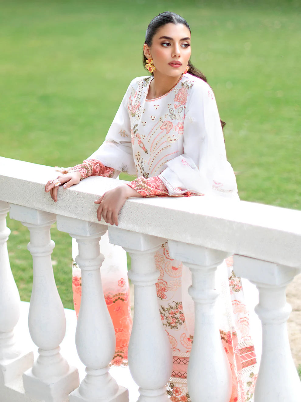 Luxury Gulfraz Lyra lawn fabric in vibrant green, showcasing a close-up of the elegant, lightweight textile pattern.