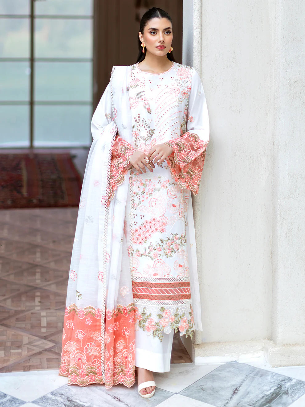 Luxurious Gulfraz Lyra lawn fabric in vibrant pattern, showcasing its fine texture and elegant design perfect for sophisticated clothing.