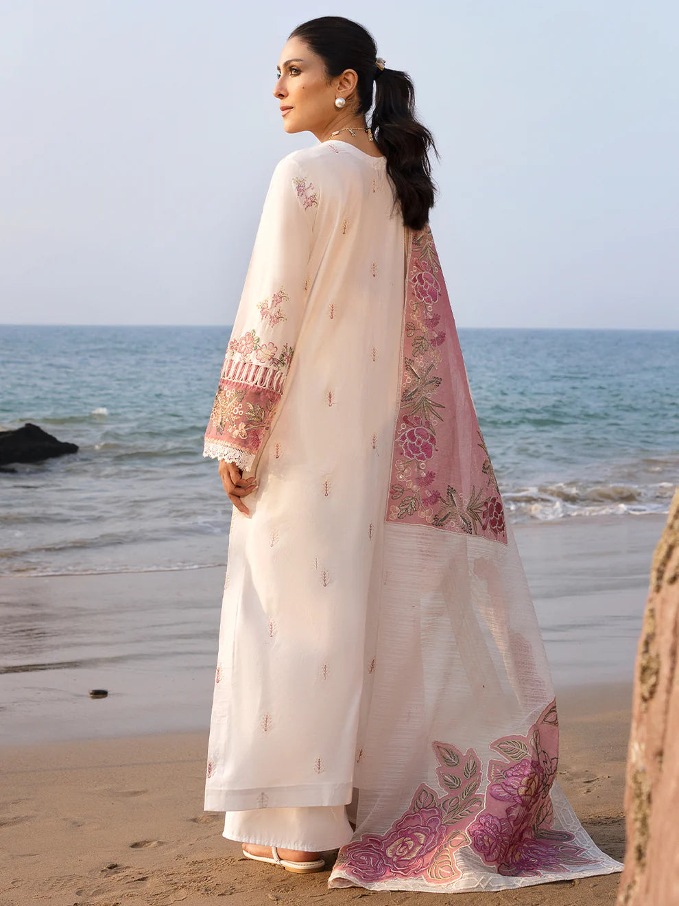 Gulfraz luxury Magnolia lawn fabric with intricate floral pattern, showcasing elegant design and rich texture.